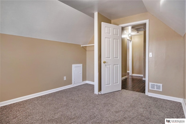 bonus room featuring carpet flooring and lofted ceiling