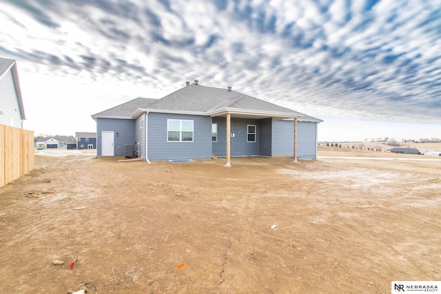 back of property with central AC unit