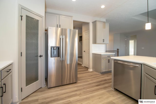 kitchen with stainless steel appliances and gray cabinets