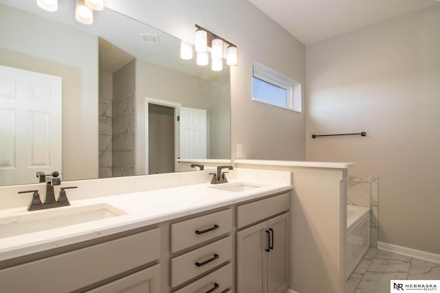 bathroom featuring vanity and a tub to relax in