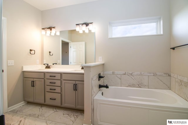 bathroom featuring vanity and a tub to relax in