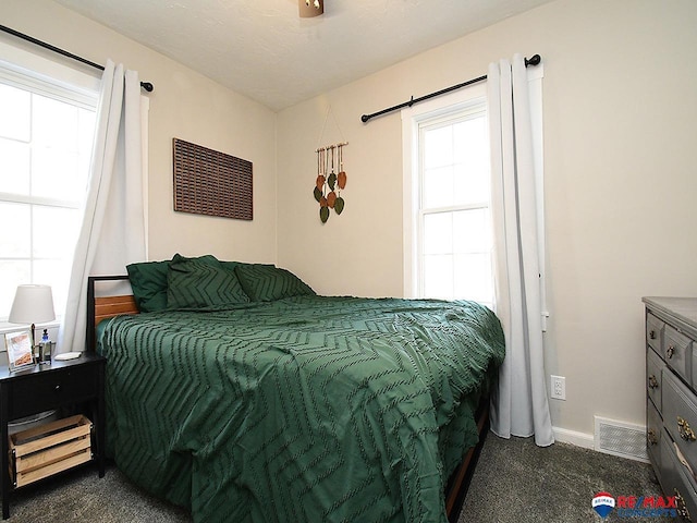 carpeted bedroom with ceiling fan