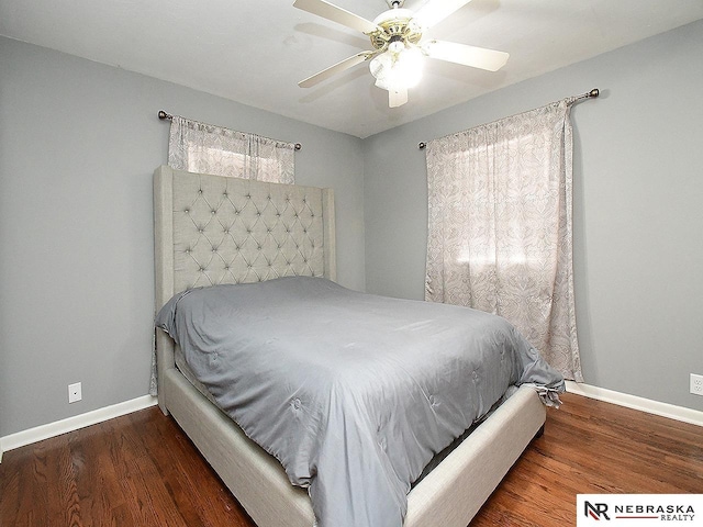 bedroom featuring ceiling fan and dark hardwood / wood-style floors