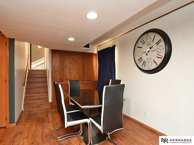 dining room with dark wood-type flooring