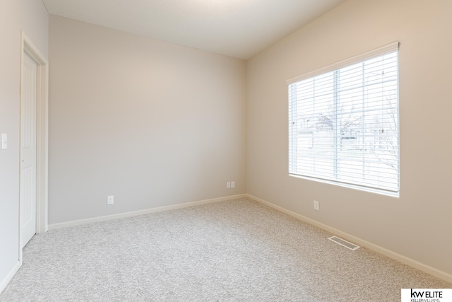 view of carpeted spare room