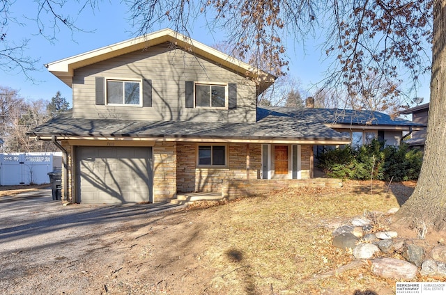 view of front facade featuring a porch and a garage