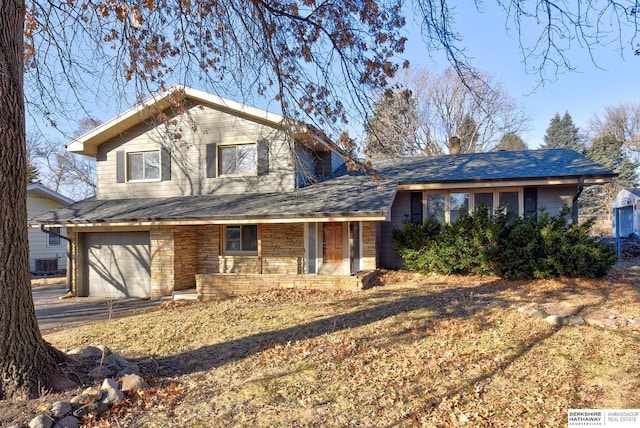 view of front of property featuring a porch and a garage