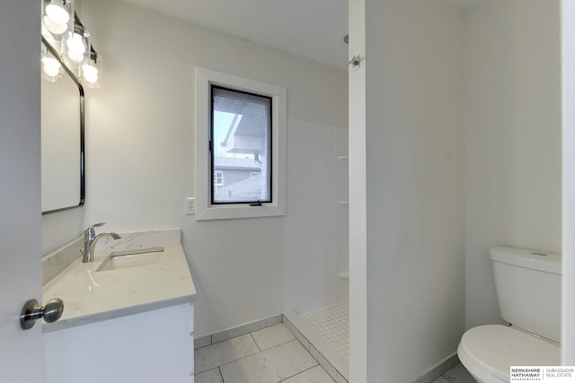 bathroom featuring walk in shower, tile patterned floors, vanity, and toilet