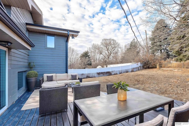 wooden deck with an outdoor hangout area