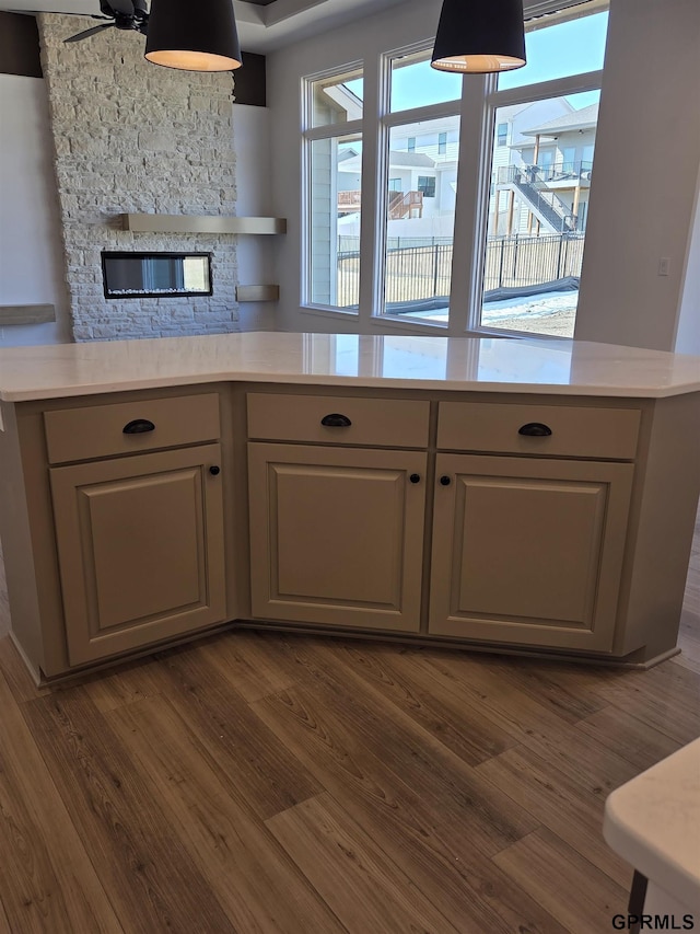 kitchen featuring light countertops, dark wood-style floors, and gray cabinetry