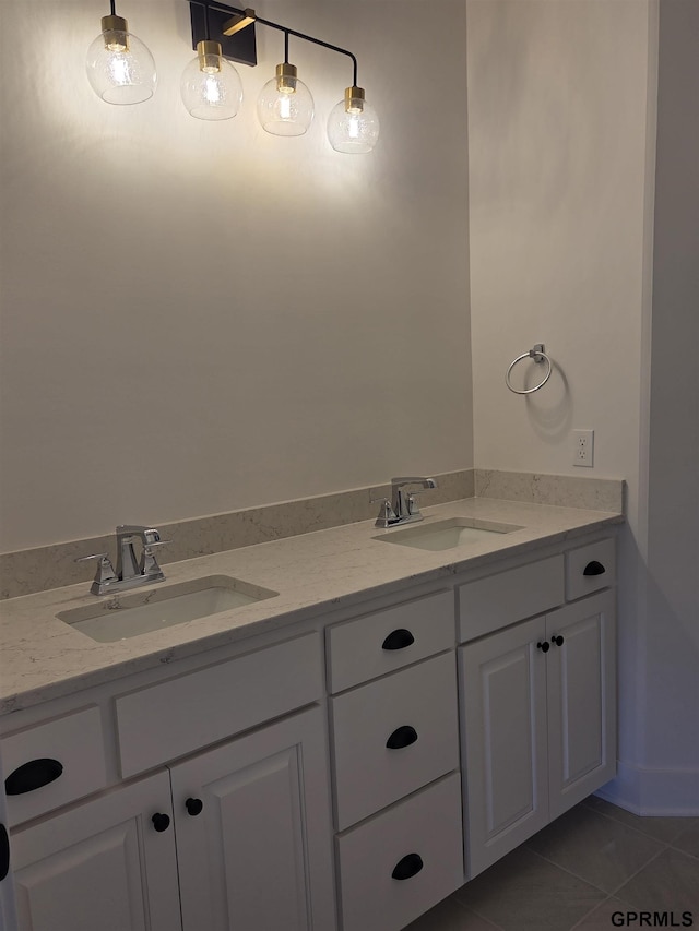 bathroom with tile patterned floors, double vanity, and a sink