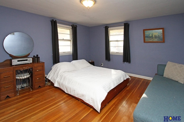 bedroom featuring dark hardwood / wood-style flooring