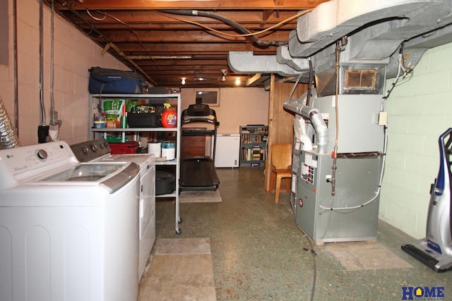 laundry area with washer and dryer and heating unit