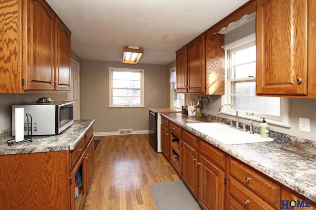 kitchen featuring sink and hardwood / wood-style flooring