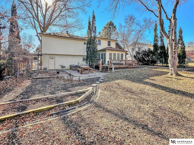 rear view of property with a deck