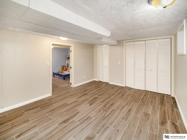 basement with a textured ceiling