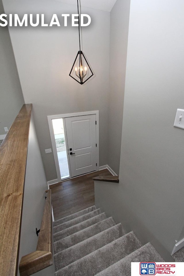 stairway featuring wood-type flooring