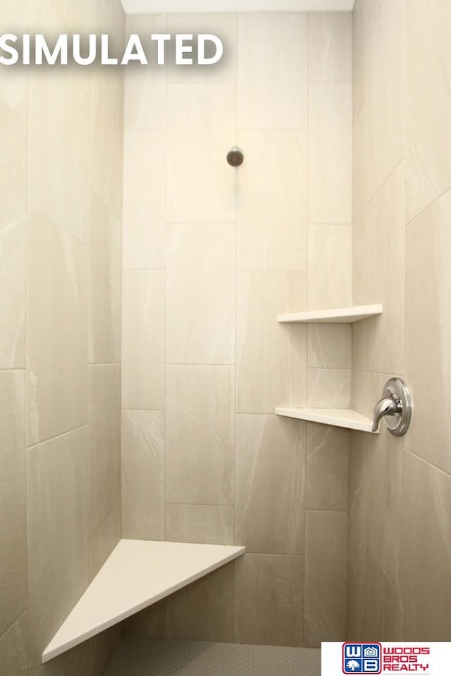 bathroom featuring tiled shower