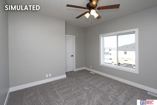 carpeted empty room with ceiling fan