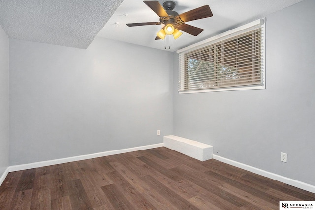 spare room featuring wood-type flooring, a textured ceiling, and ceiling fan