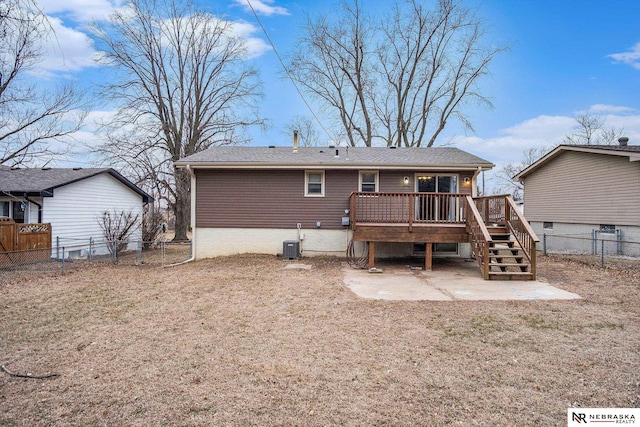 rear view of house with central air condition unit and a wooden deck