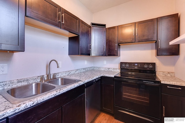 kitchen with stainless steel dishwasher, sink, black / electric stove, light stone counters, and dark brown cabinetry