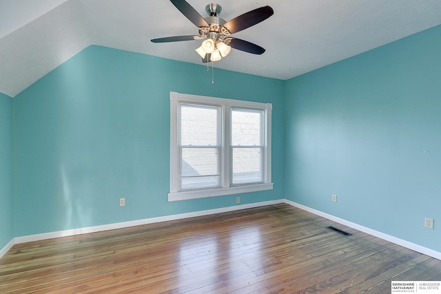 interior space with dark hardwood / wood-style floors, vaulted ceiling, and ceiling fan