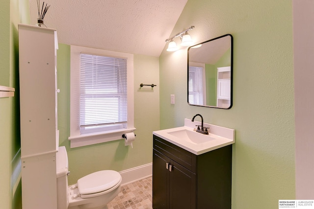 bathroom featuring vanity, toilet, a textured ceiling, and lofted ceiling