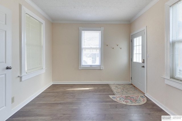 entryway with a healthy amount of sunlight, hardwood / wood-style floors, and a textured ceiling