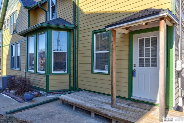 view of exterior entry featuring a deck