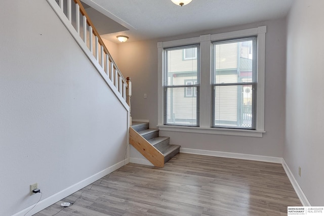 stairway featuring hardwood / wood-style floors