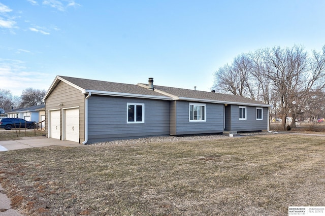 single story home with a front yard and a garage