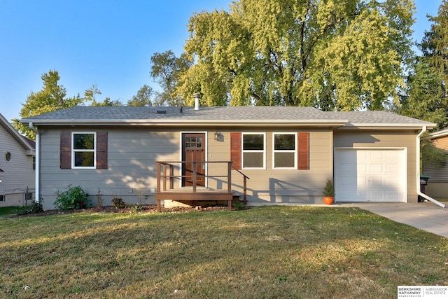 ranch-style home with a garage and a front lawn