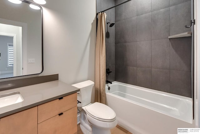 full bathroom with shower / bath combination with curtain, vanity, and toilet