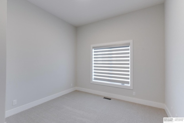 spare room with light colored carpet