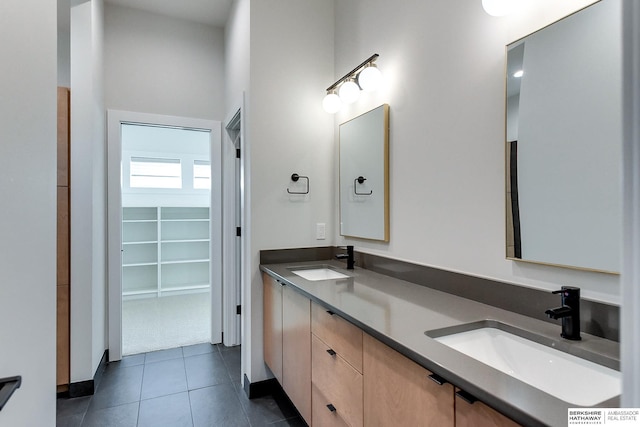 bathroom with tile patterned floors and vanity