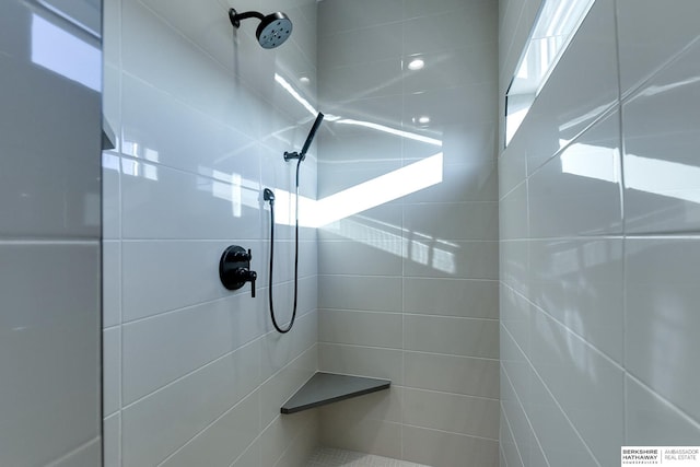 bathroom with tiled shower