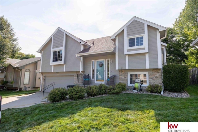 view of front facade with a garage and a front yard