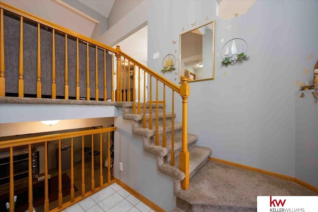 stairway with tile patterned flooring