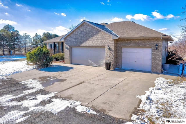 ranch-style house featuring a garage