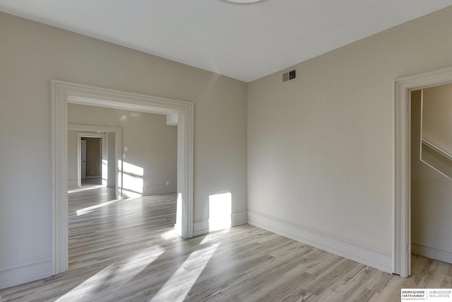 unfurnished room featuring light hardwood / wood-style floors