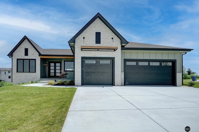 view of front of home featuring a garage and a front lawn