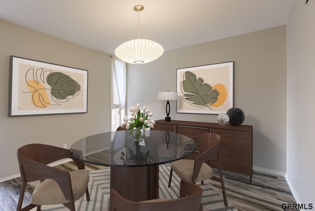 dining room with dark wood-type flooring