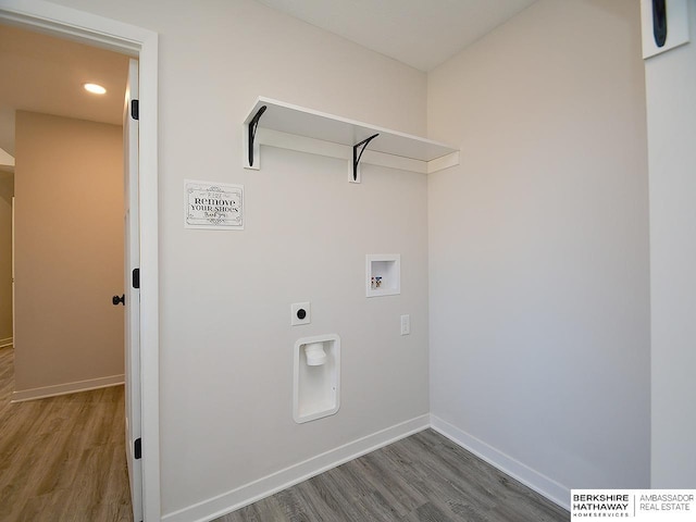 laundry area with dark hardwood / wood-style flooring, washer hookup, and hookup for an electric dryer