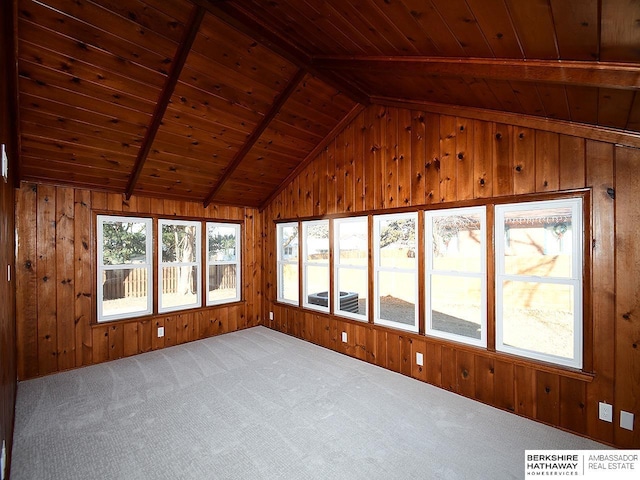 unfurnished sunroom featuring lofted ceiling with beams and wood ceiling