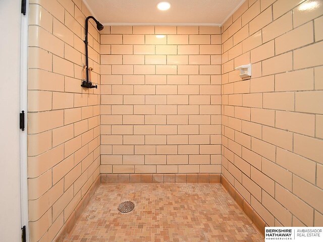 bathroom with a tile shower