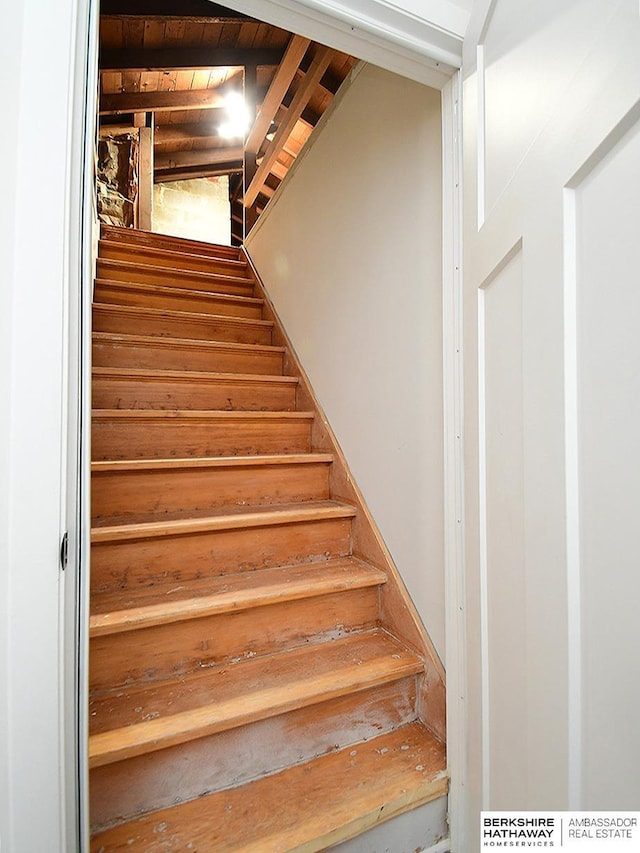 stairs with wood ceiling