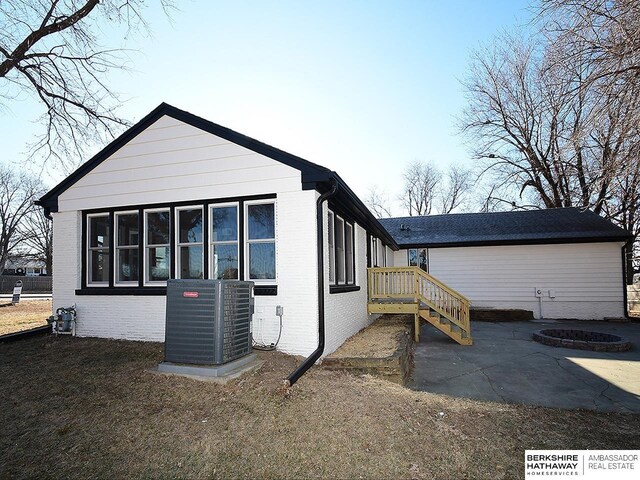 view of home's exterior featuring central air condition unit and a patio area