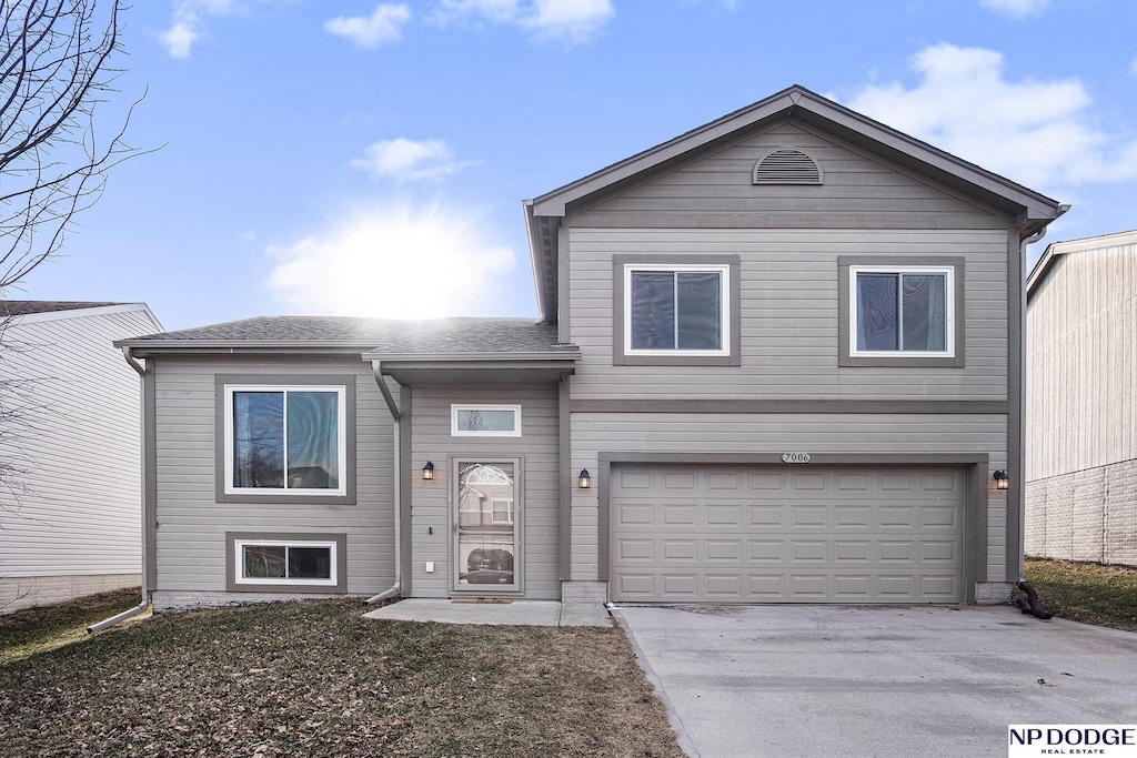 view of front of property with a garage