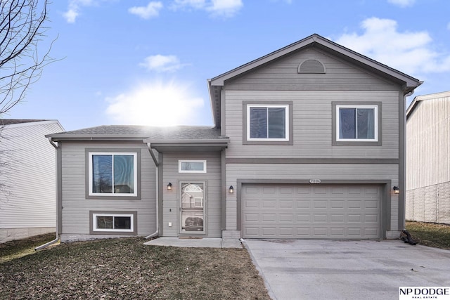 view of front of property with a garage